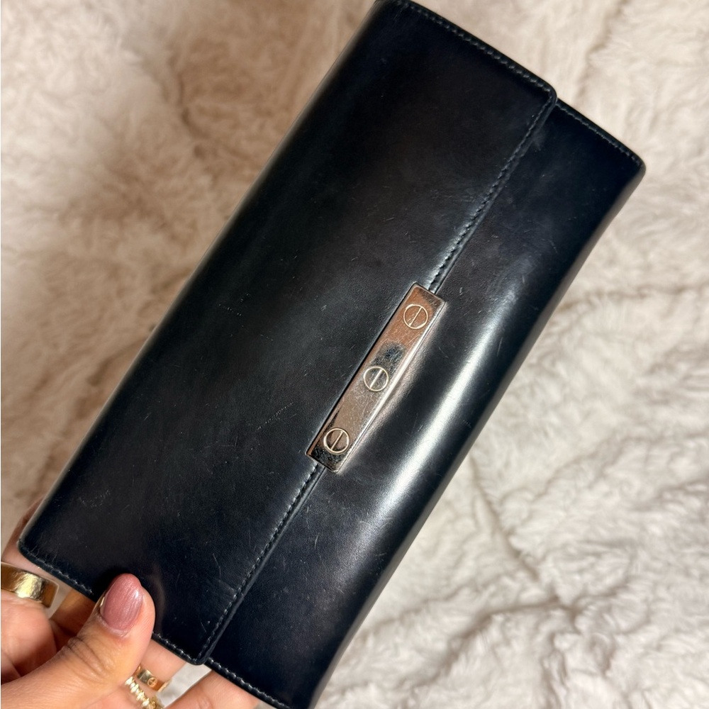 Authentic Vintage Black Cartier Leather Wallet with Silver Accent.